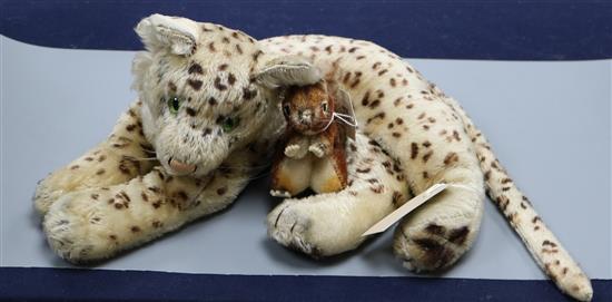 A Steiff reclining leopard with green glass eyes, circa 1940s and a small squirrel (lacking buttons)